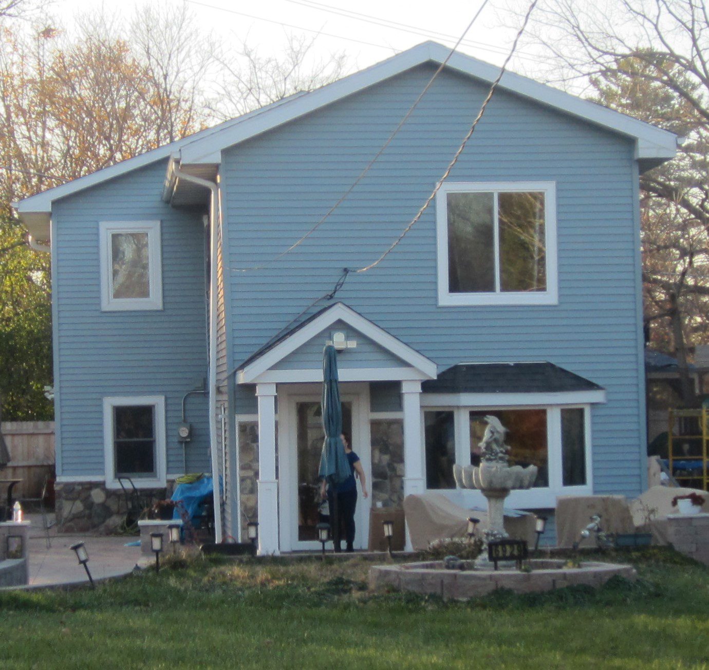Two-story home with fountain