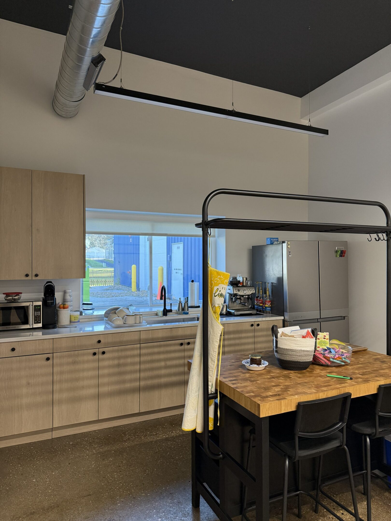 Industrial-style kitchen with large fridge
